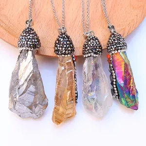 Macro detail of natural crystal pendants with shimmering rhinestones on metal caps