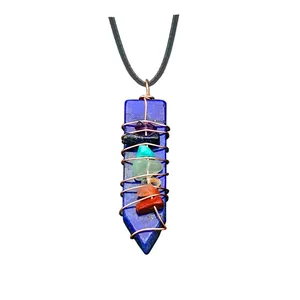 Lapis lazuli arrow pendant with handcrafted wire wrap and seven chakra healing crystals