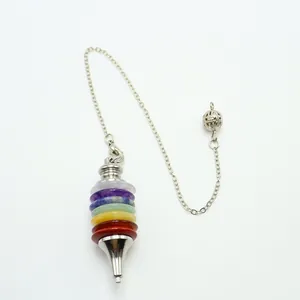 Close-up of seven chakra stone pendulum with silver metal cone and hollow ball chain