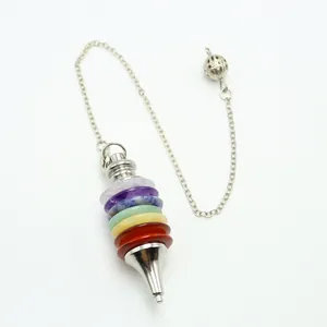 Seven chakra natural stone pendulum with silver metal cone and chain on white background