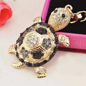 Sparkling turtle keychain with gold plating and rhinestones for handbags and cars
