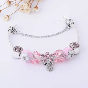 Pink charm bracelet with white leather rope, floral glass beads and cherry blossom pendant