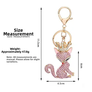 Detailed size measurement of pink rhinestone fox keychain with gold crown and d-ring