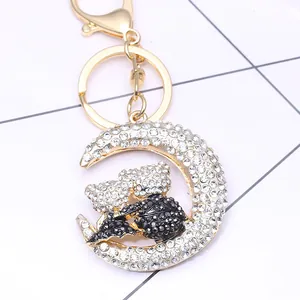 Sparkling moon and cuddling bears keychain with rhinestones and gold alloy plating