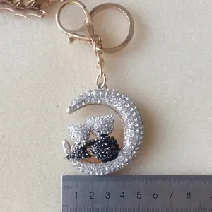 Golden moon and bear keychain with rhinestones and lobster clasp on 5cm scale