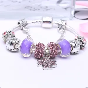 Silver snake chain bracelet with purple glass beads and pink clover charm pendant