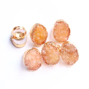 Macro detail of natural druzy agate rings with gold-plated adjustable bands