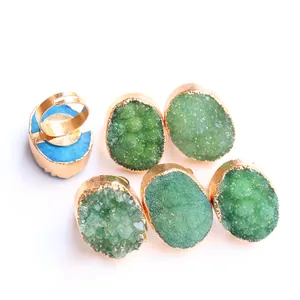 Detail view of colorful druzy agate stone rings with gold plated adjustable bands