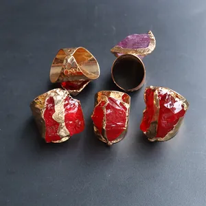 Detailed macro view of 5-piece gold plated irregular natural crystal raw stone rings