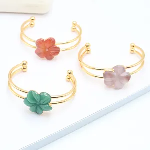 Handcrafted gold flower quartz stone bangles in green, orange, and purple hues