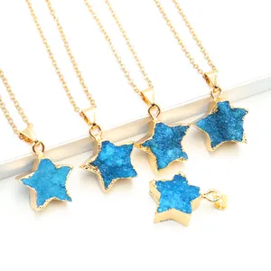 Detail view of five-pointed blue geode star pendants with golden alloy frames and chains