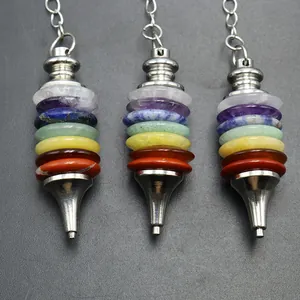 Detail of seven chakra crystal stones pendulum with layered natural round gemstone discs