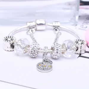 Silver charm bracelet with tree of life pendant and sparkling clear glass beads