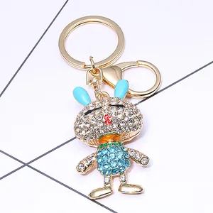 Simpatico portachiavi a coniglio dorato con strass blu e cristalli per borse