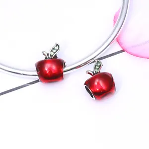 Red enamel apple charm bead with green crystals on a silver bracelet for DIY jewelry