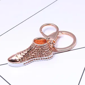 Sparkling rose gold sneaker keychain with champagne rhinestones and lobster clasp accessory