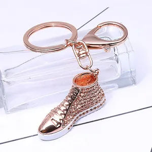 Rose gold crystal canvas shoe keychain with sparkling rhinestones and lobster clasp
