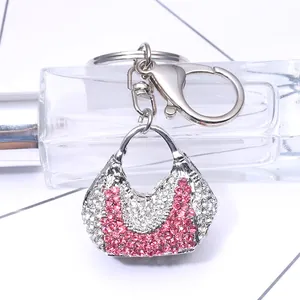 Pink crystal encrusted handbag keychain with silver metal ring and lobster clasp