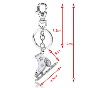 Porte-clés patin à glace en émail blanc avec strass brillants et fermoir mousqueton