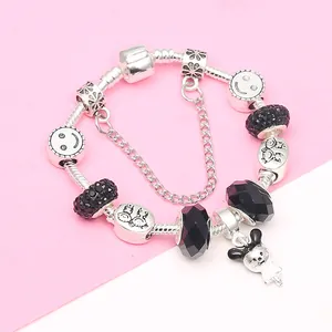 DIY silver-plated charm bracelet with black beads and a cute doll pendant