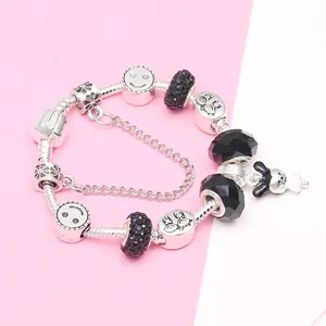 DIY silver-plated charm bracelet with black beads and a cute cartoon rabbit pendant