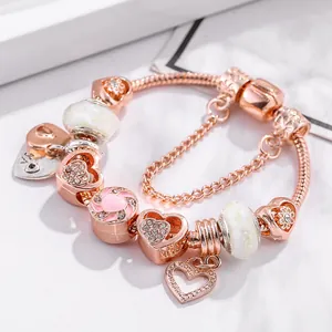 Rose gold crown charm bracelet with pink crystal hearts and enamel flowers for women