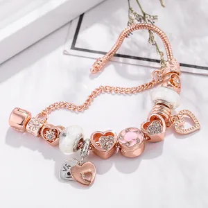 Rose gold crown snake chain bracelet with pink enamel heart and crystal beads charm