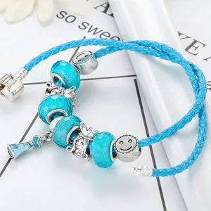 Blue cartoon princess beaded bracelet with silver smiley face and crown charms