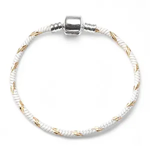 Detail of 3mm white and gold snake chain bracelet with a silver barrel clasp