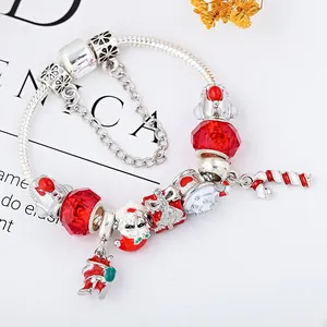 DIY Christmas beaded charm bracelet with Santa Claus and red candy cane charms on silver chain
