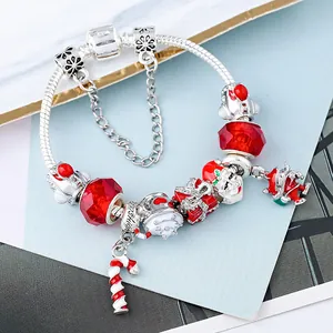 DIY Christmas charm bracelet with Santa Claus and red beads on silver snake chain