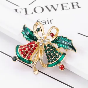 Golden Christmas bell brooch with red and green rhinestones and green holly leaves