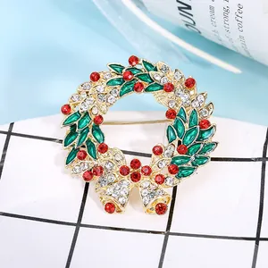 Christmas wreath brooch with colorful rhinestones, green enamel leaves and golden bells