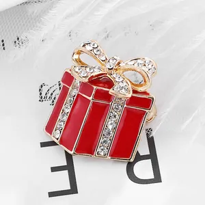 Christmas gift box brooch in gold-plated alloy with red enamel and sparkling rhinestones