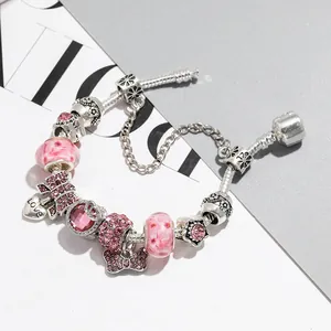Bracelet à nœud rose avec cœur en cristal et perles de verre sur chaîne serpent argentée