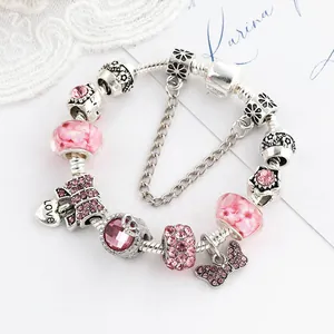 Bracelet à breloques nœud rose et cœur avec cristaux étincelants sur chaîne serpent argent