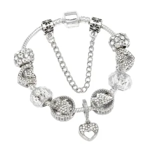 Bracciale unicorn con ciondolo a cuore, cristalli bianchi e catenella di sicurezza