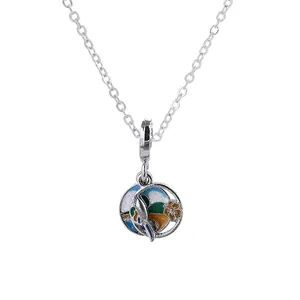 Minimalist silver alloy necklace featuring a colorful enamel landscape pendant on white
