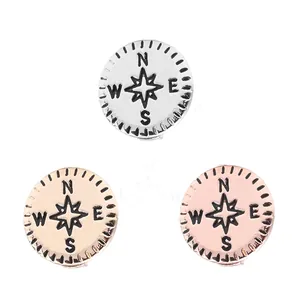 Trois breloques boussole de 10mm en argent, or et or rose avec gravures des points cardinaux