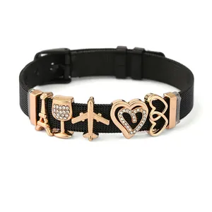 Black mesh keeper bracelet with rose gold Eiffel Tower, plane and heart charms