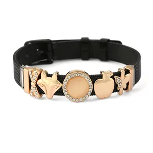 Black Milanese mesh bracelet with rose gold fox and starfish charms on white background