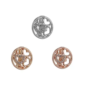 Orecchini a cuore cavo con strass scintillanti nei toni argento e oro rosa