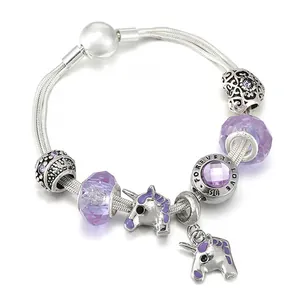 Silver snake chain bracelet featuring purple glass beads and unicorn pendants with engraving
