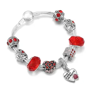 Silver chain bracelet with red crystal beads and engraved heart pendant for women