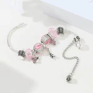 Bracelet serpent argenté avec cristaux roses, pendentifs Tour Eiffel et couronne
