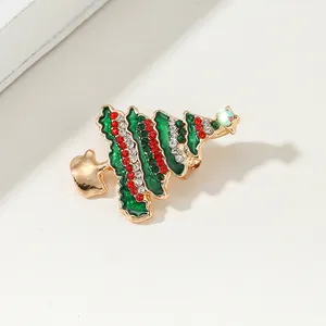 Green enamel Christmas tree brooch with red and white rhinestones on gold alloy base