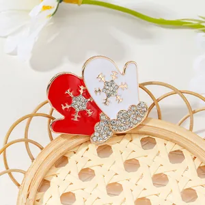 Christmas red and white glove brooch with rhinestone snowflake in gold plating