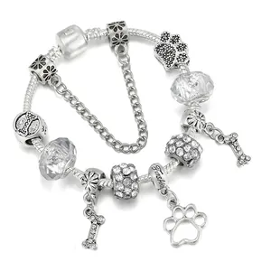 Bracciale con ciondoli placcato argento con impronte di cane e ossa su catena snake