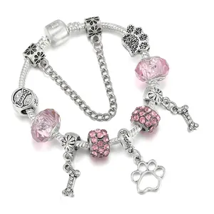 Bracciale a catena serpente argentato con perle di cristallo rosa e ciondoli zampa
