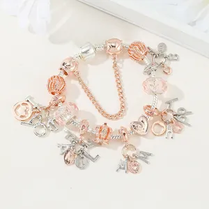 Pulsera con dijes de plata y oro rosa con colgantes Family y cuentas rosas